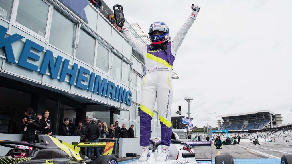 Jamie Chadwick celebrating a race win standing on her car